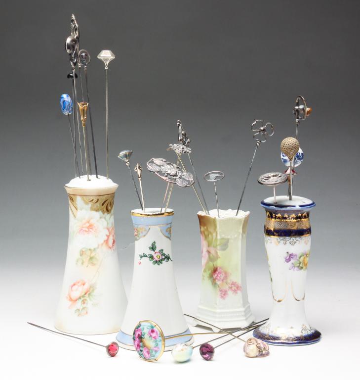 GROUP OF HAT PINS AND HOLDERS.: Twentieth century. One holder marked Prussia, one marked Germany, one marked Nippon, one unmarked.