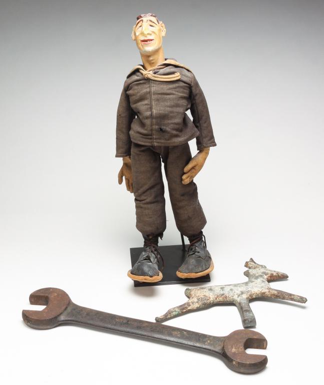 FIGURE AND CAST IRON TARGET AND WRENCH. (1 of 6)