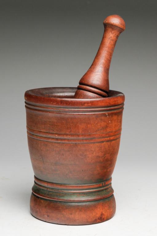 AMERICAN PESTLE AND MORTAR.: Second half 19th century, oak and pine. Both pieces have ring turning and mortar has traces of green paint. 13.5"h.