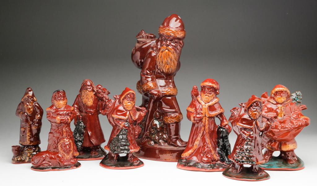 EIGHT CONTEMPORARY GLAZED REDWARE SANTAS. (1 of 9)