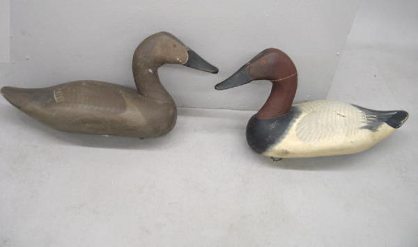 PAIR OF CARVED CANVASBACK DECOYS BY CAPT. HARRY JO: PAIR OF CARVED CANVASBACK DECOYS BY CAPT. HARRY JOBES. (Aberdeen, Maryland). Drake and hen in original paint with very good form. Both have hairline splits on the neck. 16 3/4"l., 16 1/2"l.