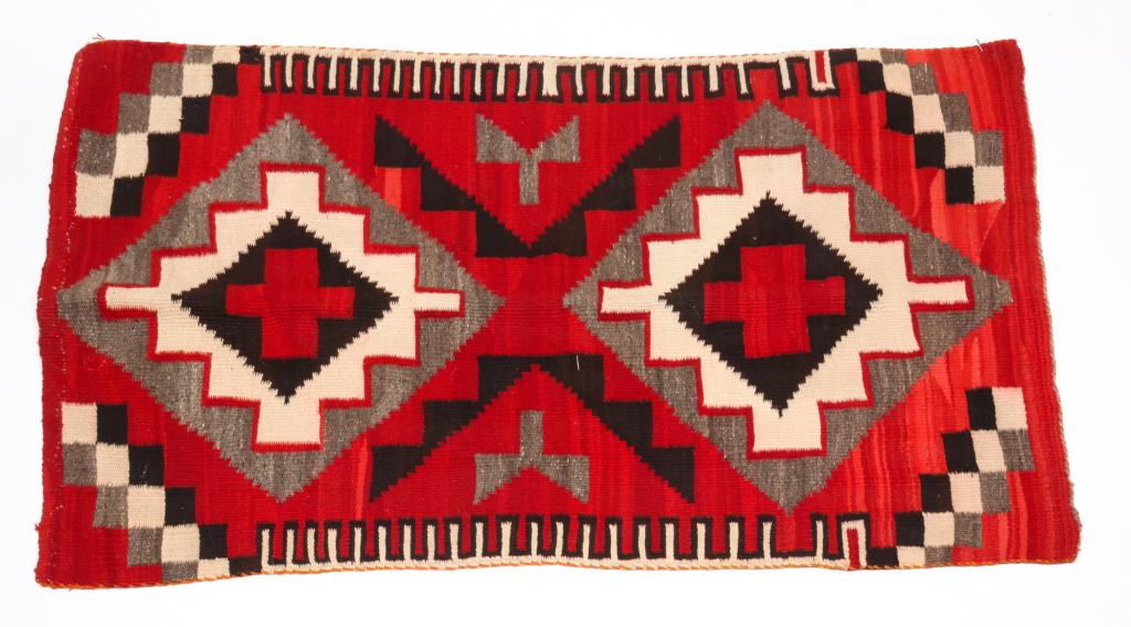 NAVAJO RUG.: Mid 20th century. Stepped diamonds in shades of red, grey and black. Minor color bleeding. 38" x 62".