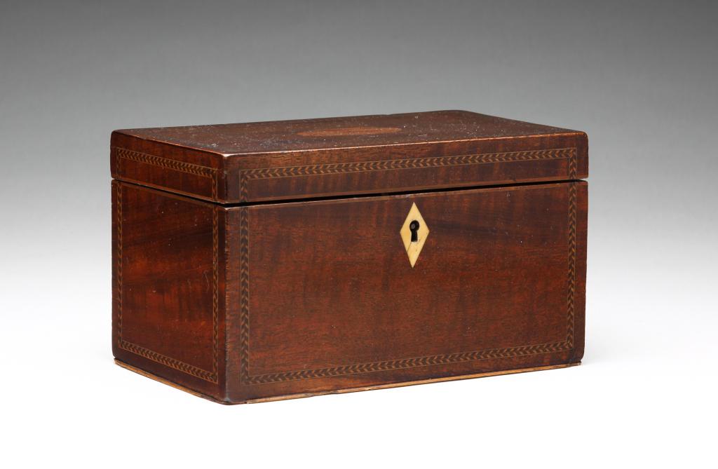 ENGLISH GEORGIAN INLAID TEA CADDY.: Late 18th-early 19th century, mahogany veneer. Simple form with herringbone and medallion inlay, bone escutcheon. Single interior lid has slight warp, compartment missing divider, flaking overpaint. S