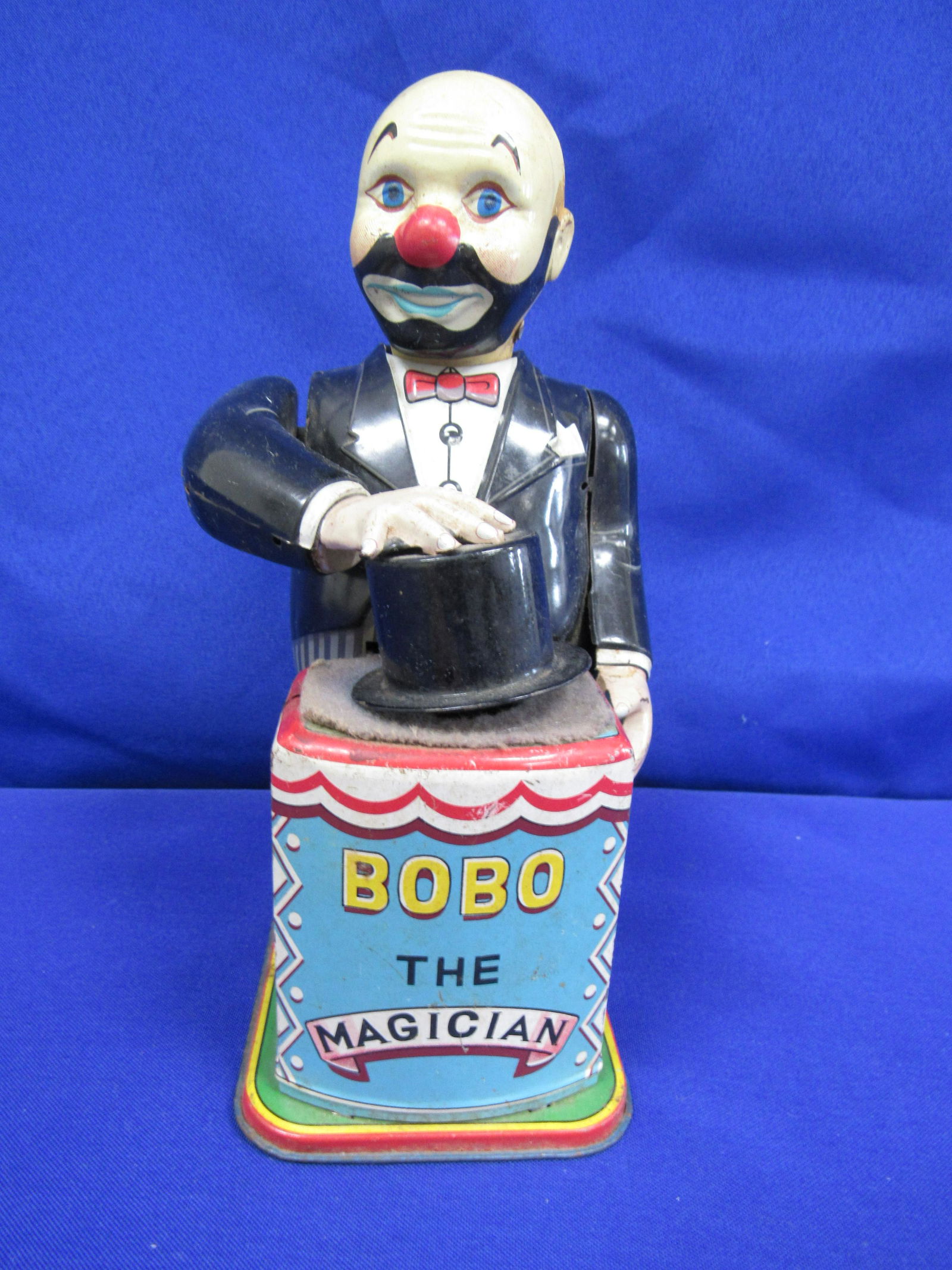 T.N. HAPPY-GO-LUCKY MAGICIAN WIND-UP TOY (1 of 4)