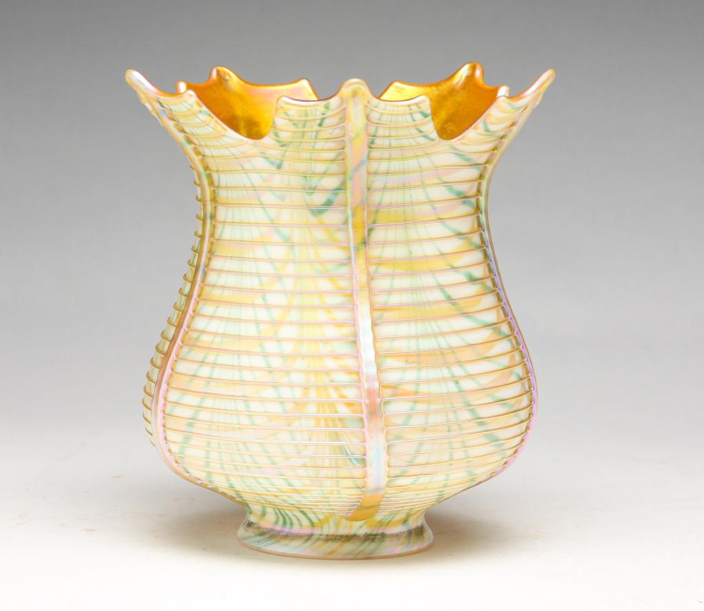 SIGNED QUEZAL ART GLASS SHADE.: American. 1st quarter-20th century. Iridized, green pulled feather with opaline threading and scalloped rim. 2.25" fitter. 5.5"h.