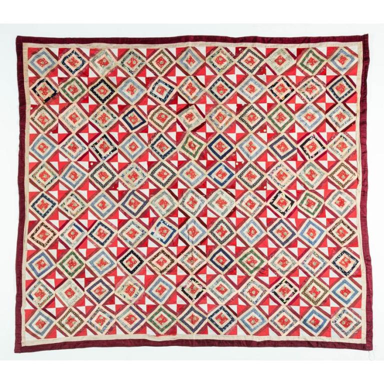 AMERICAN PIECED QUILT.: Late 19th-early 20th century. Log Cabin pattern in various printed and satin fabrics. Machine stitched border and square edges. Some wear. 70" x 70".