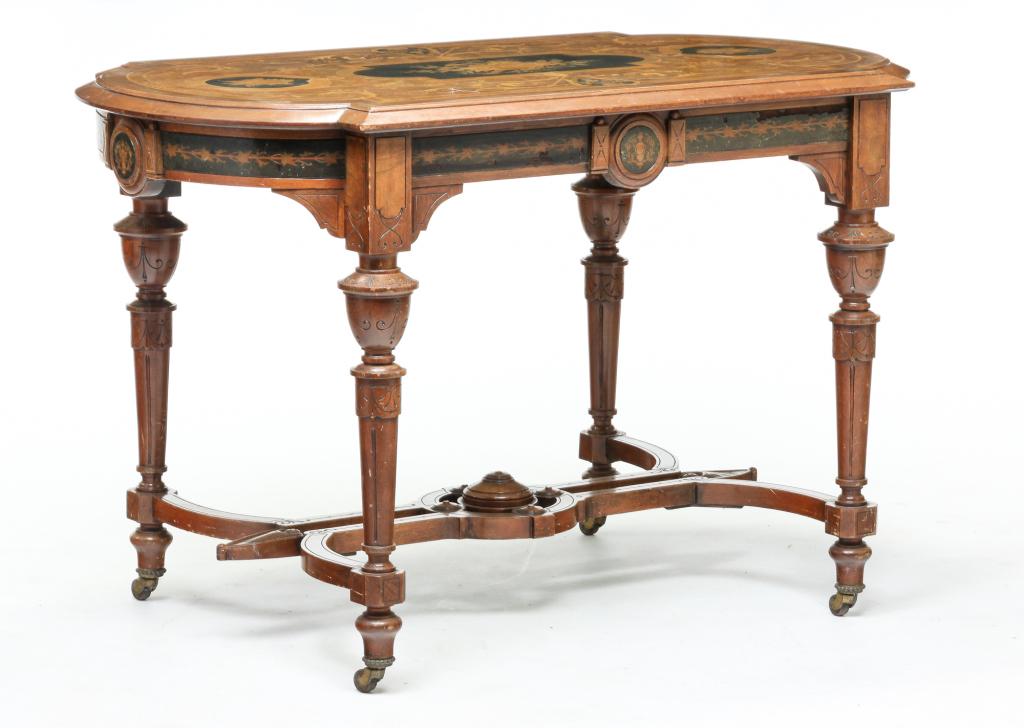 AMERICAN VICTORIAN INLAID CENTER TABLE.: Second half 19th century, walnut with varying inlays. Top with rounded ends, turned legs and shaped stretcher with carving and floral, musical instruments, dragon's head and anthemion inlays. Refinish