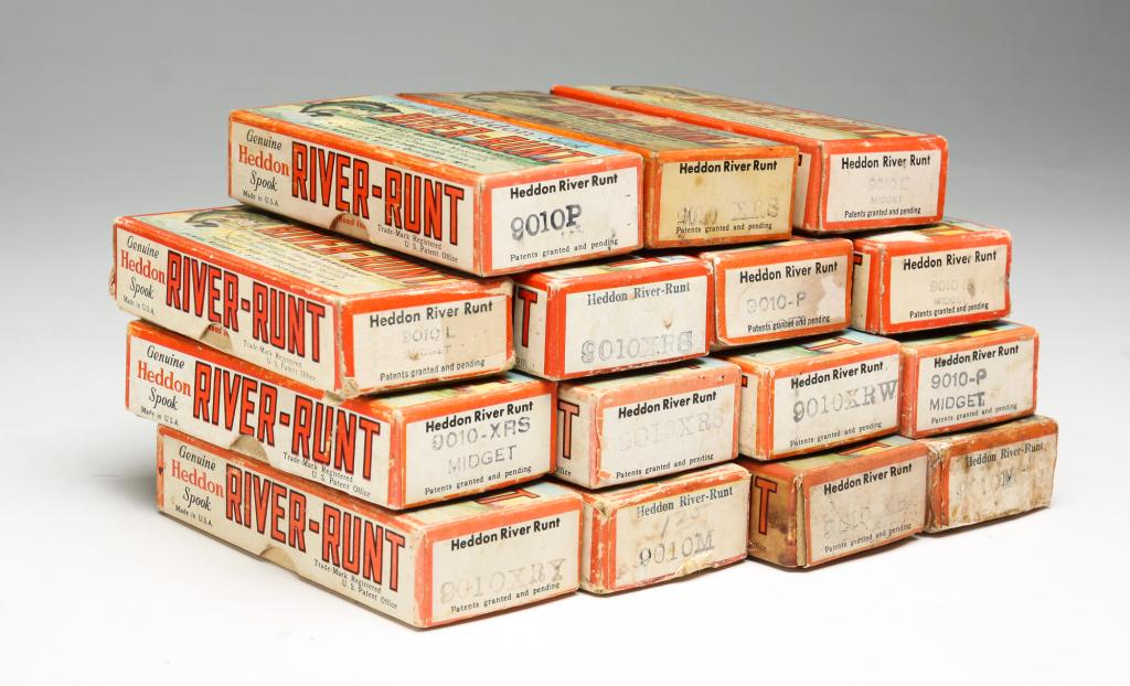FIFTEEN HEDDON RIVER RUNT MIDGET FISHING LURES: Group of fifteen Heddon River Runt Midget lures in original boxes. Various color patterns, some with original paper inserts.