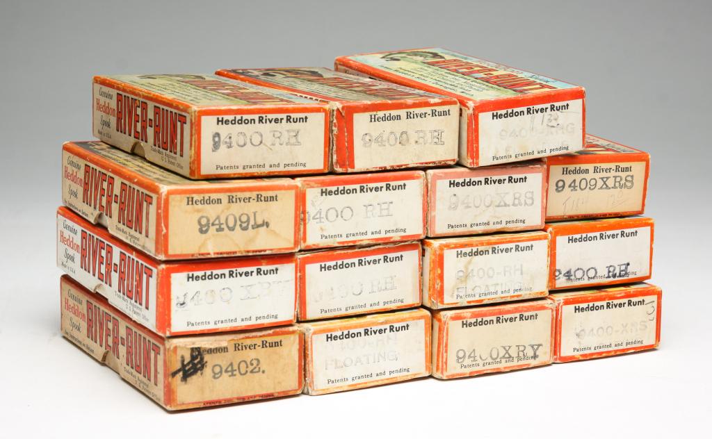 FIFTEEN HEDDON RIVER RUNT SPOOK LURES WITH BOXES: Group of fifteen Heddon River-Runt lures. All are Spook Floater in original boxes, some having original paper inserts. Various color patterns and conditions.