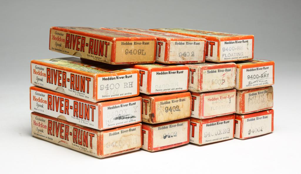 FIFTEEN HEDDON RIVER RUNT SPOOK FISHING LURES: Group of fifteen Heddon River-Runt lures. All are Spook Floater in original boxes, some having original paper inserts. Various color patterns and conditions.