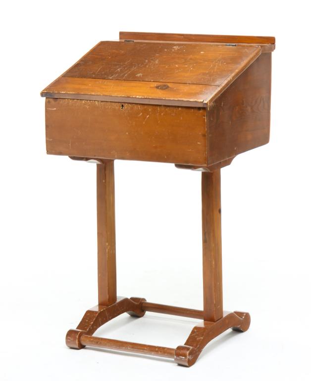 AMERICAN SLANT LID DESK.: Second half 19th century, pine. Hinged lid, fitted interior and stretcher base with turnings. Refinished with some wear and scratches. 36.75"h. 22"w. 19.75"w. 31.5" writing surface.