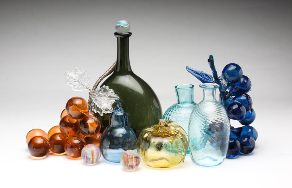 AMERICAN AND EUROPEAN GLASS ITEMS.: Nineteenth and twentieth century. Including early European green glass bottle. 8.5"h. European glass fruits. Two bunches of grapes, an apple and pear. Two small American glass bottles, three color swi