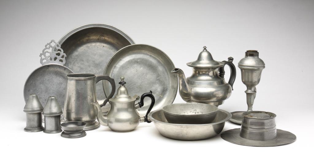 AMERICAN AND EUROPEAN PEWTER.: Nineteenth century. Thirteen pieces. Bowls, porringer, teapots, inkwell with underplate, tankard, chamber lamp, salt and pepper and late salt. Varying wear and dents. Inkwell 7"w. Chamber lamp 7.5"h.