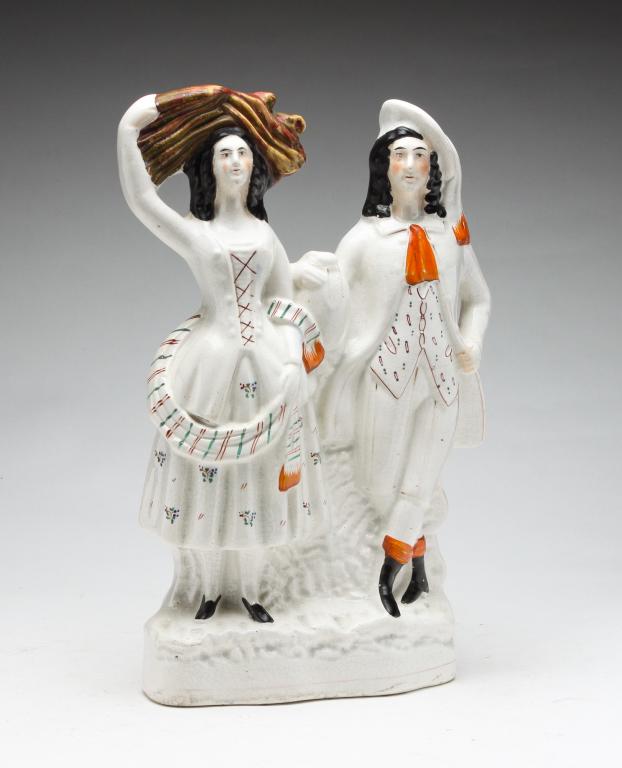ENGLISH STAFFORDSHIRE FIGURINE.: Second half 19th century. Standing woman and man. 13..25"h. 7"w.
