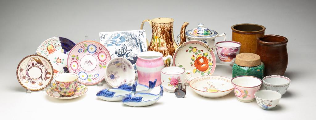 GROUP OF MISCELLANEOUS PORCELAIN AND POTTERY.: Twentieth century. Twenty three pieces. Including cups, saucers, fish dishes, stoneware jugs, delft tile trivet and teapot. Varying wear, loss and repairs.