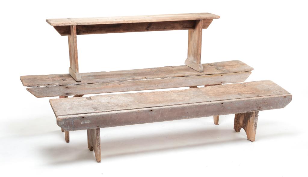 THREE AMERICAN COUNTRY BENCHES.: Second half 19th century, pine. One with brown paint and half-round cutouts, 15.5"h. 68.5"w. 12.5"d. One with trestle base, 16.75"h. 52"w. 9.25"d. And the last has worn red paint, 18"h. 72"w. 12"d. We