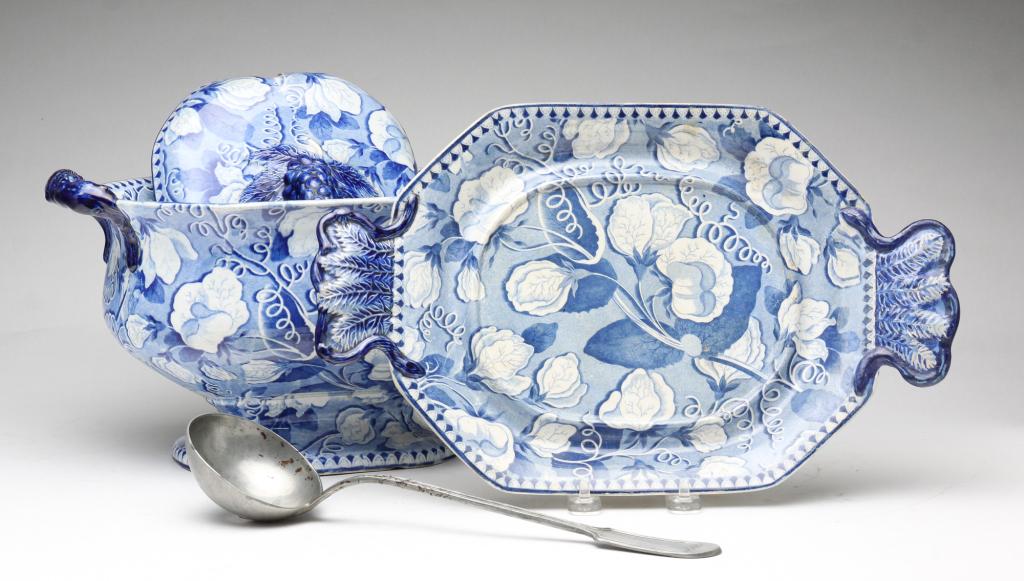 STAFFORDSHIRE TRANSFERWARE SOUP TUREEN.: England, 2nd quarter 19th century. Tureen and underplate marked "Brameld + S". Blue and white floral design. Chips, stains and professional repair. 13"w. Pewter ladle. Wear and rust. 12.5"l.