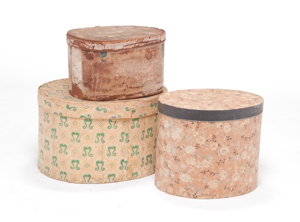 THREE AMERICAN BAND BOXES.: Wallpaper decorated oval boxes. Two19th century boxes. One bentwood with iron tacks 13"w. One with green decoration. 17.5" w. Twentieth century box with floral decoration and newspaper lining. 13.5" w