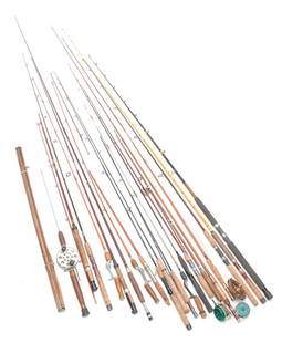 GROUP OF MODERN AND VINTAGE FLY FISHING RODS.: Second half 20th century. Includes bamboo (one in a wooden holder), Eagle Claw, Shakespeare, and several graphite, Black Widow, Daiwa, Browning. Together with four having reels, three Heddon and Prema