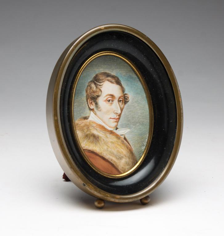 EUROPEAN MINIATURE OF A MAN.: Ca. 1820s. Signed "N. Salomon". Well done portrait of a man wearing a fur collared coat. Oval brass frame, 5.5"h. 4.25"w.