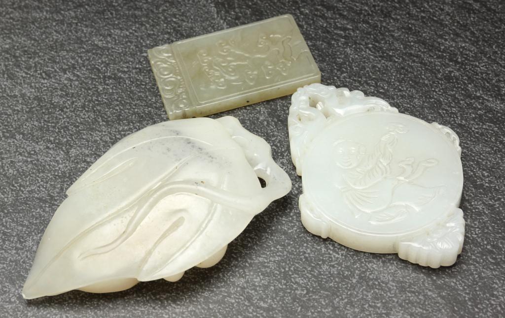 TWO CHINESE JADE PENDANTS AND A CARVING. (1 of 2)