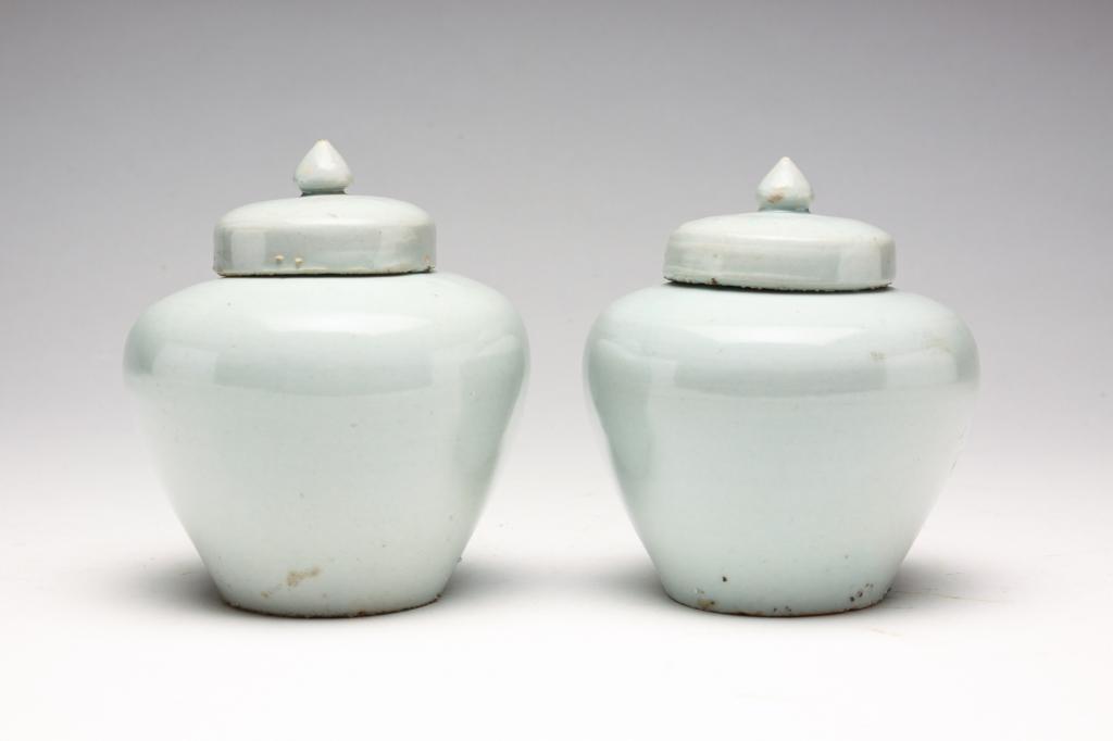 PAIR OF KOREAN POTTERY COVERED JARS. (1 of 3)