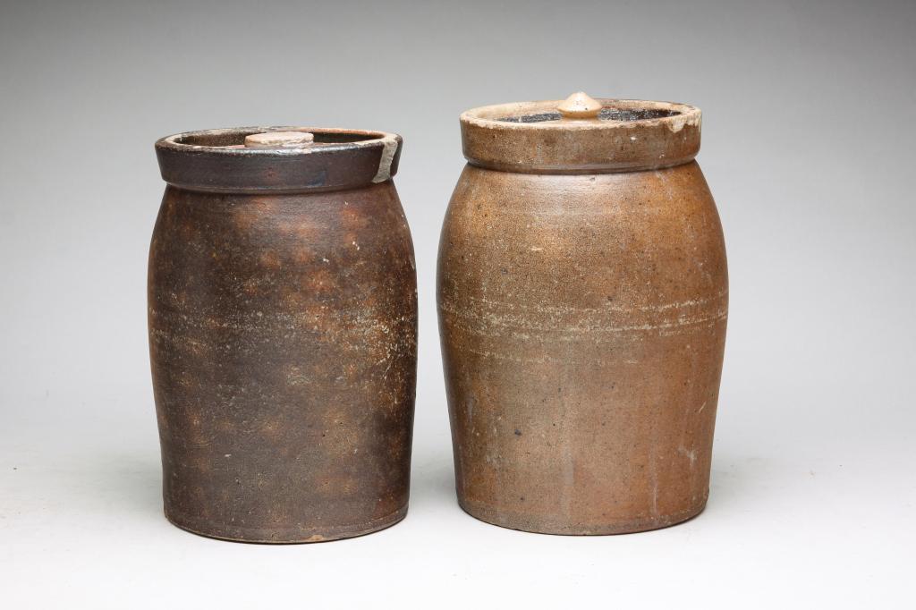 TWO OREGON STONEWARE CROCKS.: Most likely Oregon Pottery Company, 4th quarter 19th century. With closely matched lids. Chips. 9.5", 10"h.