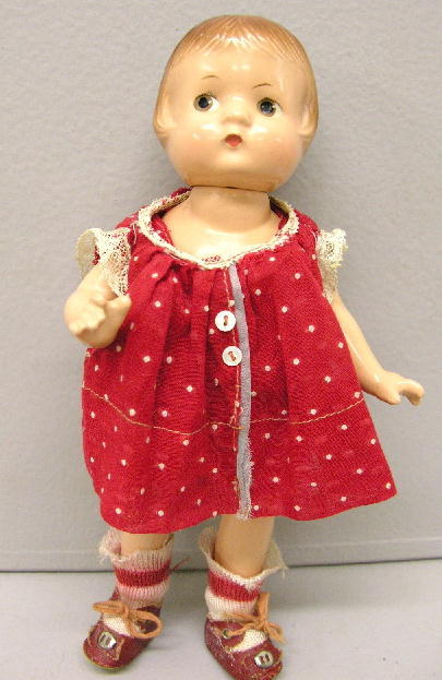 EFFANBEE PATSYETTE, 9". Marked on back "EFFANBEE P: EFFANBEE PATSYETTE, 9". Marked on back "EFFANBEE PATSYETTE DOLL". Brown painted hair and eyes, original clothes. Small chip on neck plus two tiny splits, typical wear at joints, socks stretched, sole