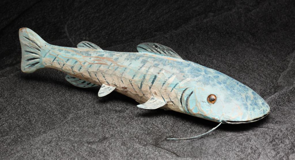 AMERICAN ICE FISHING LURE.: Second half 20th century. carved wood with tin fins and original paint. 12"l.