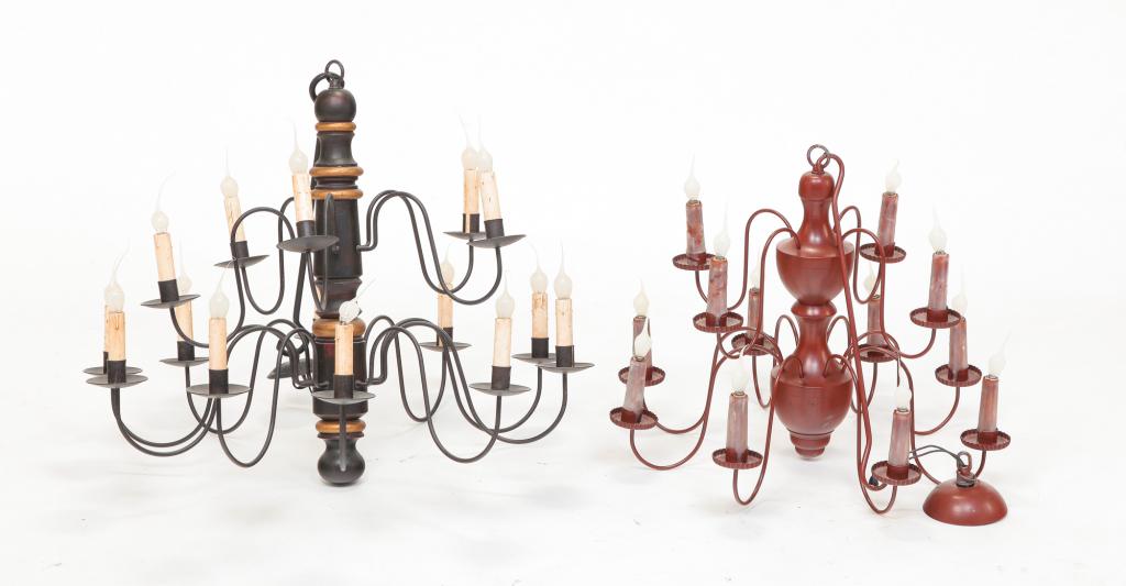 TWO EARLY AMERICAN PERIOD STYLE CHANDELIERS.: Late 20th century. In the 18th century style, two tiers of lights, "S" shaped metal arms and turned center columns. In reddish-brown paint with twelve lights.19"h. 24" dia. and in black paint with gol