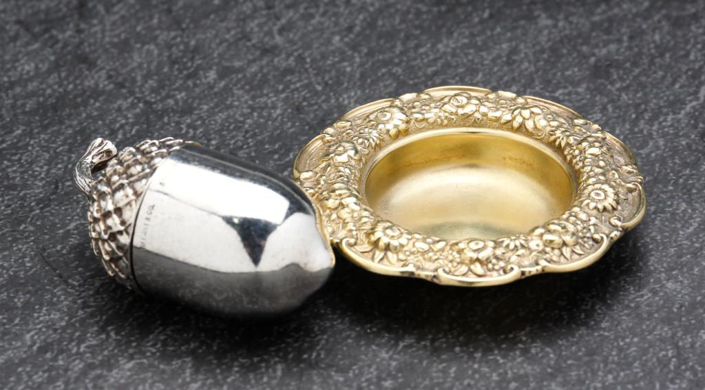 TWO TIFFANY & CO STERLING SILVER PIECES.: American, 19th - 20th century. Including a vermeil miniature dish, 2"w, and a late acorn thimble holder. 1.75"h. Approx. 1 ozt.