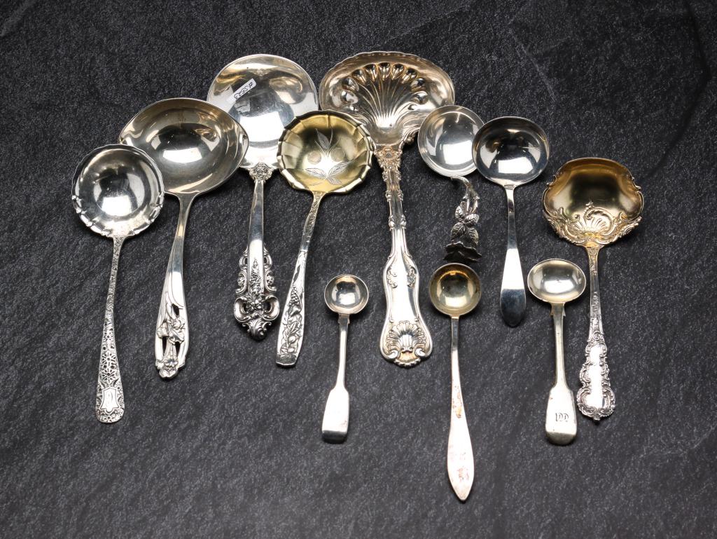 GROUP OF SILVER LADLES.: American and English, 19th - 20th century. Including sterling silver pieces from Whiting, Wallace, International and three coin silver piece. Approximately 11 ozt.