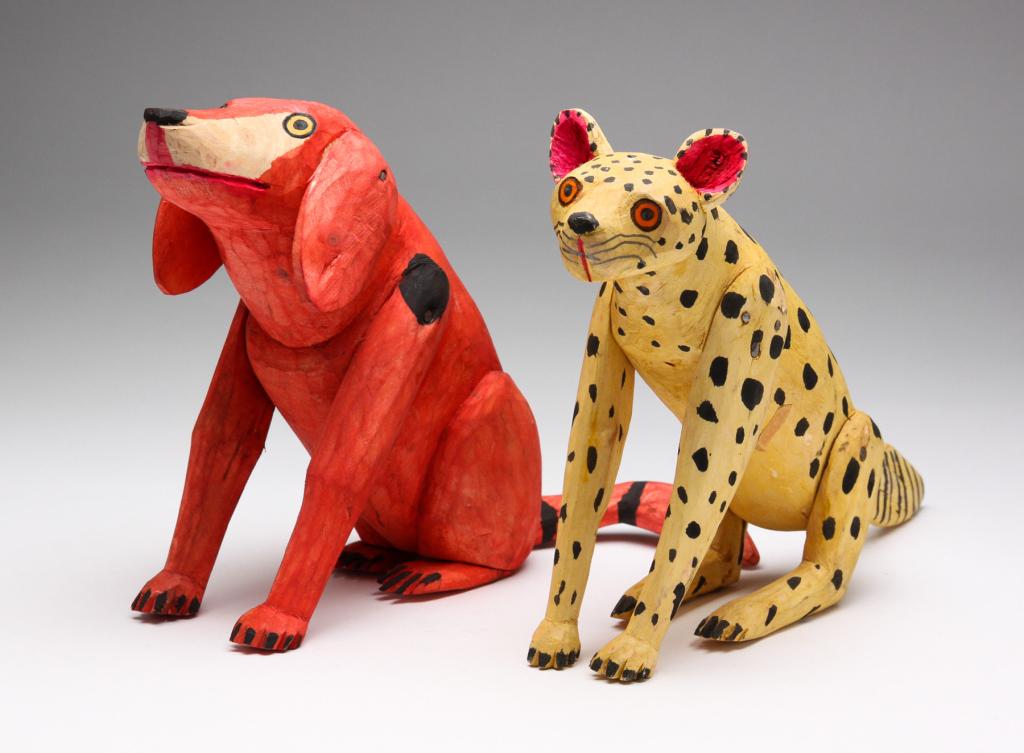 TWO ANIMALS IN THE STYLE OF MANUEL JIMENEZ RAMIREZ: Late 20th century. Carved wood with original paint. Cheetah, 6.75"h. and red dog stamped "Hecho en Mexico", 6.5"h.