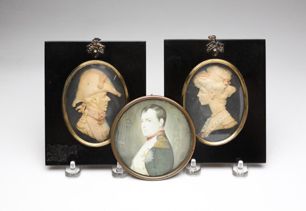 THREE FRAMED PORTRAITS.: European, late 19th - early 20th century. Portrait of Napoleon. Framed. 4"w. Pair of wax portraits by Leslie Ray. Framed. Some loss and wear to wax. 6"h. 5"w.