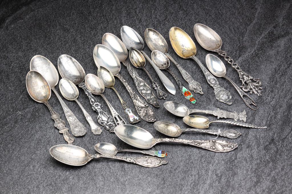 STERLING SILVER SOUVENIR SPOONS.: American and English, late 19th - early 20th century. Featuring spoons from Ohio, Washington D.C., Hawaii, California and Canada. Twenty-one spoons. Varying lengths from 3.5" - 6"l.