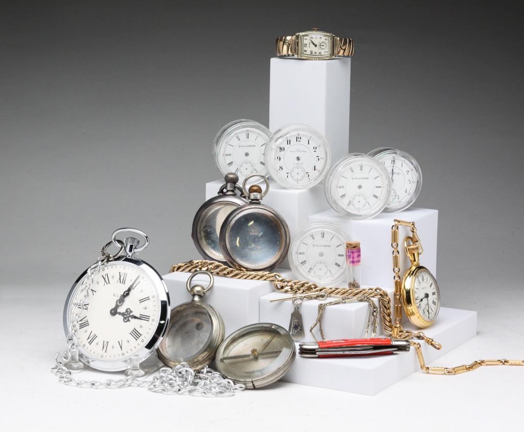 MISC. GROUP OF WATCH RELATED ITEMS.: Late 19th - 20th century. Group includes: Columbus Watch Co. 18S movement #287855 with dial (hairlines); three Columbus Watch Co. dials; one New Columbus Time King dial, 21 Jewels; compass in silver m