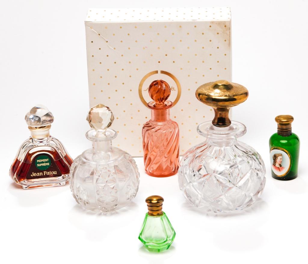 GROUP OF PERFUME BOTTLES.: Late 19th and 20th century. Included are Caron "Nuit de Noel" 2000, Jean Patou "Moment Supreme," emerald green, milk glass reserve with portrait, cut glass, etched glass, cut overlay atomizer base, sc