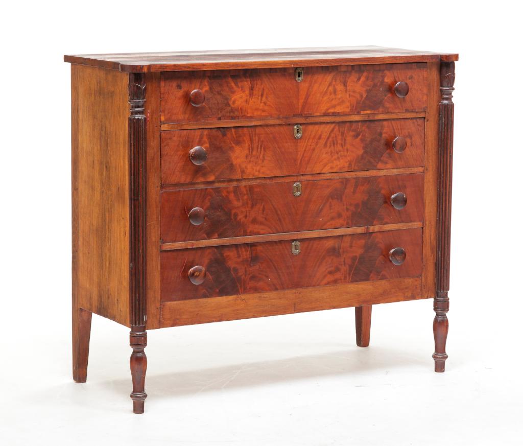 AMERICAN SHERATON CHEST.: Ca. 1820s, mahogany with poplar secondary. Shaped lop with ovolo corners and reeded pilasters with foliate carving. Four dovetailed drawers with original wooden pulls. Square nail construction. Late r