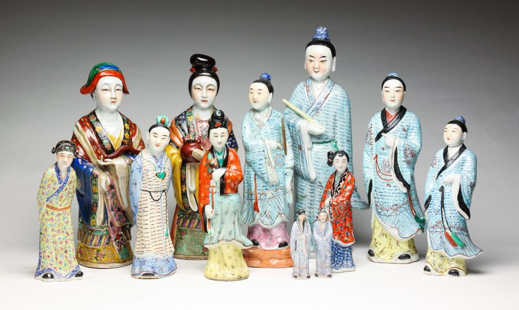 TWELVE CHINESE PORCELAIN FIGURES.: Second half 20th century. Standing figures with polychrome decorated robes. Most are either stamped or impressed "China" with other impressed seals. Minor wear and two smallest have some edge loss. 4"