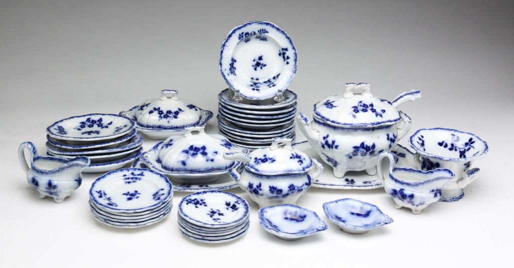 GROUP OF MINIATURE "FLOW BLUE" CHINA.: England, third quarter 19th century. Forty assorted pieces. Floral sprig pattern. Includes tureens, lidded casseroles, platters, plates, bowls and creamers. Varying wear and loss.