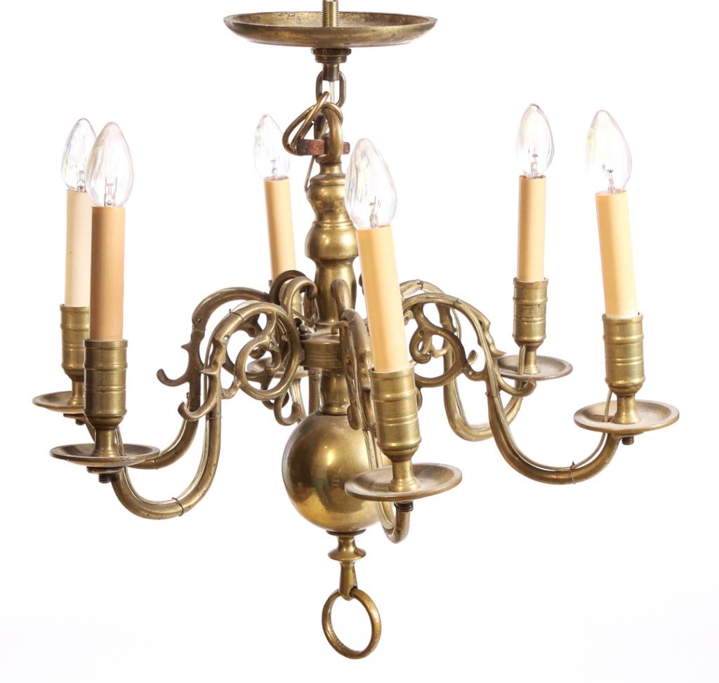 AMERICAN COLONIAL STYLE BRASS CHANDELIER.: Mid 20th century. Period style construction with six pinned scrolled arms. Electrified with circular brass ceiling cap. Approx. 18"h.