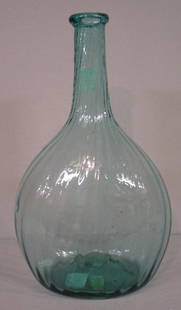 MIDWESTERN AQUA BLOWN BOTTLE. Good form: MIDWESTERN AQUA BLOWN BOTTLE. Good form with twenty-five swirled ribs. Applied lip. Pot stones and a scratch. 8 3/4"h.