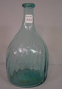 ZANESVILLE AQUA BLOWN BOTTLE. Club shape: ZANESVILLE AQUA BLOWN BOTTLE. Club shape with twenty-four swirled ribs. Applied lip (chip). Minor wear and a few broken blisters. 7 3/4"h.