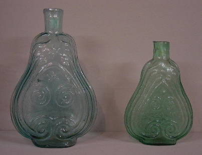 TWO AQUA SCROLL FLASKS. Quart. Minor res: TWO AQUA SCROLL FLASKS. Quart. Minor residue, 9"h. And GIX-8. Pint with "Louisville Glass Works". Iron pontil. Rim flakes and residue. 7"h.