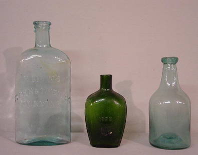 THREE BOTTLES. Pale aqua flask "M'Lean's: THREE BOTTLES. Pale aqua flask "M'Lean's Strengthening Cordial" with applied, tooled lip. 8 3/4"h.; small dark green flask "1928", 5"h. and an aqua bottle with a high kick up. Applied lip.