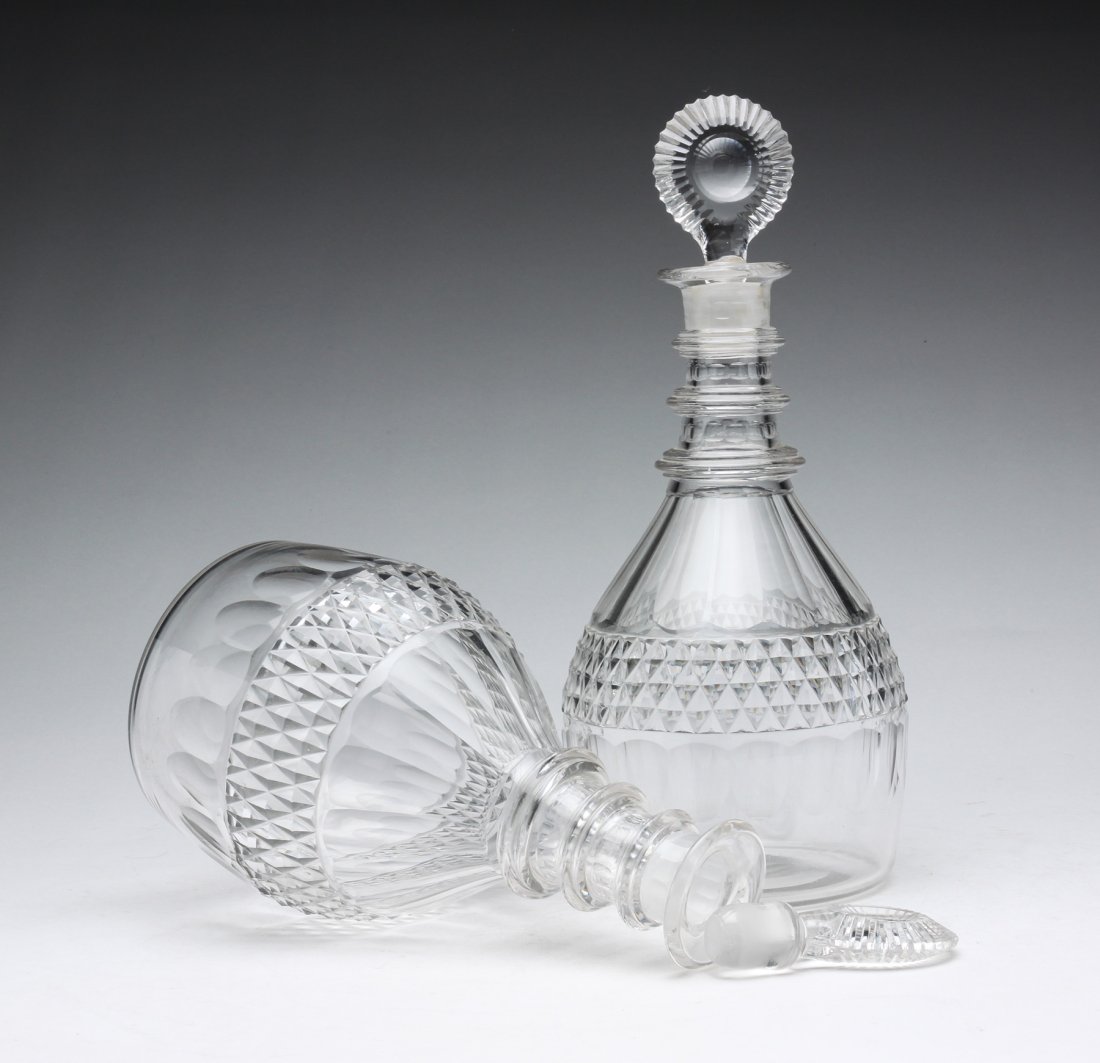 A PAIR OF ANGLO-IRISH CUT GLASS DECANTERS. (1 of 3)