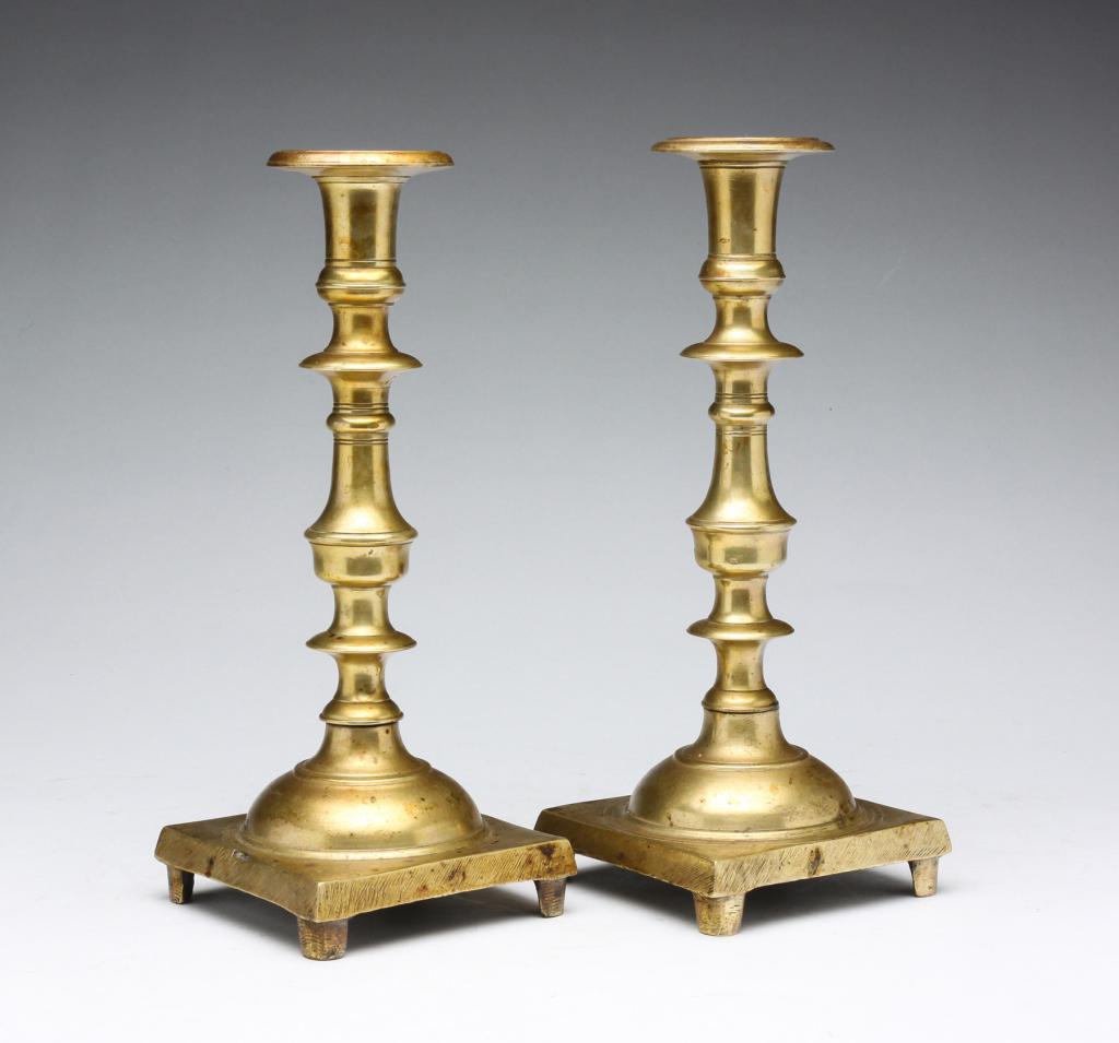 A PAIR OF EASTERN EUROPEAN CANDLESTICKS. (1 of 5)