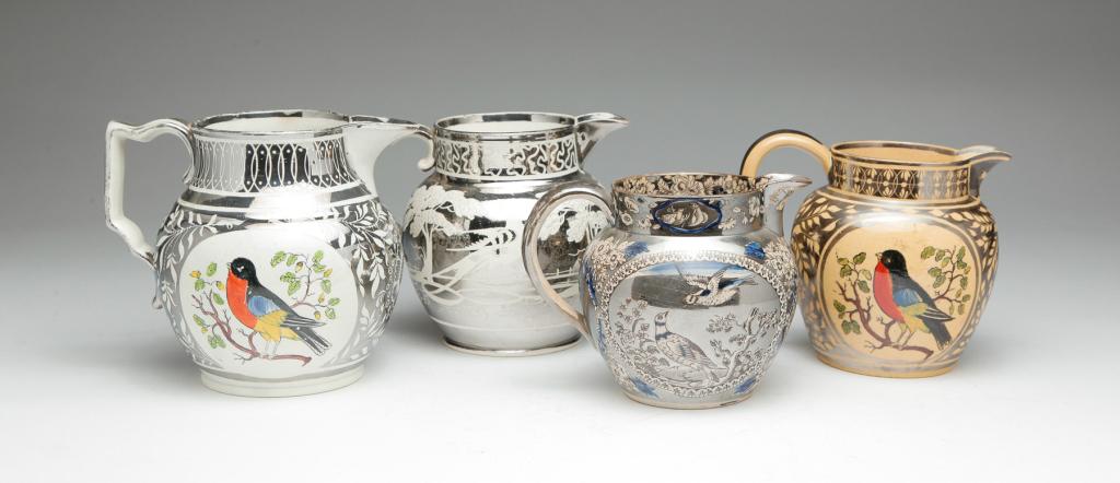 FOUR ENGLISH SILVER RESIST PITCHERS. (1 of 7)