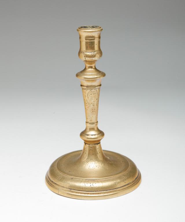EUROPEAN ENGRAVED BRASS CANDLESTICK. (1 of 5)