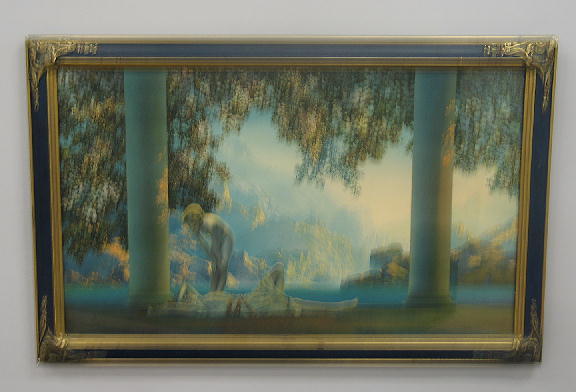 FRAMED MAXFIELD PARRISH PRINT "DAY BREAK" Depicts: FRAMED MAXFIELD PARRISH PRINT "DAY BREAK" Depicts a nude leaning over a friend who is lying between stone pillars with lake and mountains in background. Slight foxing. Blue and gold frame has shell an